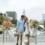 Couple kissing with NYC skyline backdrop, symbolizing love rekindled through dedicated marriage counselors who understand urban relationship dynamics.
