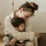 Perinatal mood disorder therapy NYC, Manhattan, Brooklyn, woman, hugging child, bonding, counseling, Queens, therapist, comfort